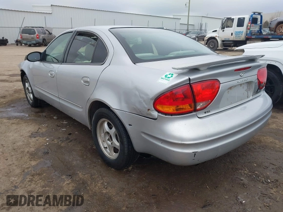 2003 Oldsmobile Alero GL1 z VIN 1G3NL52F43C169291, wystawiony jako IAAI lot #41546681 z przebiegiem 176 341 mil mil oraz . Historia ofert i sprzedaży dostępna na DreamBid. Obrazek 3.