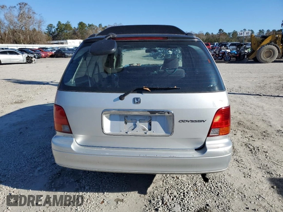 1997 Honda Odyssey with VIN RA11239041, listed as a Copart auction lot 85819024 with 79,952 mi miles and Salvage title. Bid and sale history available at DreamBid. Image 6.