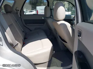2009 Ford Escape Hybrid with VIN 1FMCU49309KC11542, listed as a IAAI auction lot 42028593 with 168,573 mi miles. Bid and sale history available at carsss.com. Image 8.