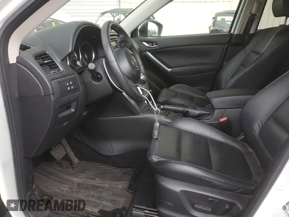 2014 Mazda CX-5 Grand Touring with VIN JM3KE4DY2E0354795, listed as a Copart auction lot 70713544 with 58,848 mi miles and Salvage Title. Bid and sale history available at DreamBid. Image 7.