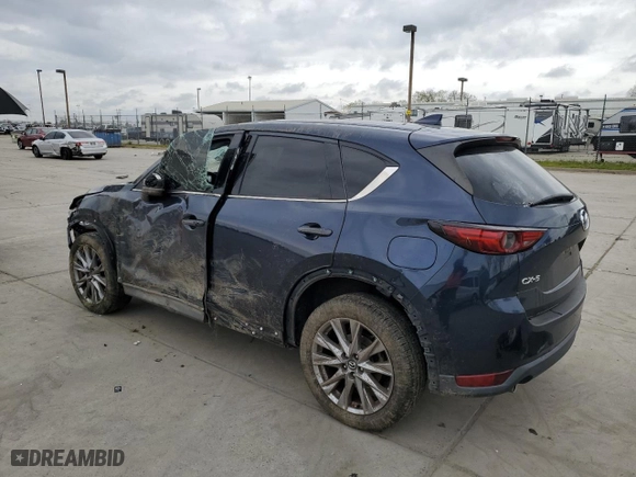 2021 Mazda CX-5 Grand Touring with VIN JM3KFADM8M1321415, listed as a Copart auction lot 47685415 with 90,145 mi miles and Salvage Title. Bid and sale history available at carsss.com. Image 2.