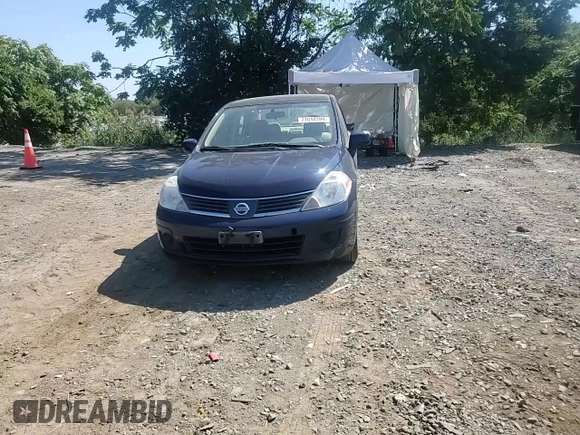 2007 Nissan Versa 1.8 SL with VIN 3N1BC11E27L432802, listed as a Copart auction lot 71018594 with 118,795 mi miles and Salvage Title. Bid and sale history available at carsss.com. Image 11.