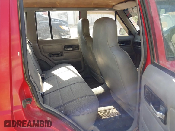 1996 Jeep Cherokee z VIN 1J4FB28S4TL145447, wystawiony jako IAAI lot #42414080 z przebiegiem 437 448 mil mil oraz . Historia ofert i sprzedaży dostępna na DreamBid. Obrazek 8.