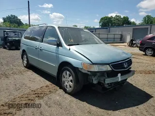 2004 Honda Odyssey EX-L z VIN 5FNRL18044B020316, wystawiony jako Copart lot #56027435 z przebiegiem 192 429 mil mil oraz Szkoda całkowita • Salvage title. Historia ofert i sprzedaży dostępna na DreamBid. Obrazek 14.