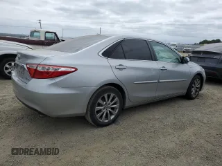 2015 Toyota Camry LE with VIN 4T1BD1FKXFU151730, listed as a Copart auction lot 54393225 with 219,892 mi miles and Salvage title. Bid and sale history available at DreamBid. Image 3.