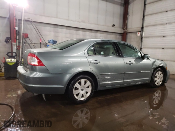 2006 Mercury Milan with VIN 3MEFM07Z06R655446, listed as a Copart auction lot 43464885 with 124,439 mi miles and Salvage title. Bid and sale history available at DreamBid. Image 3.
