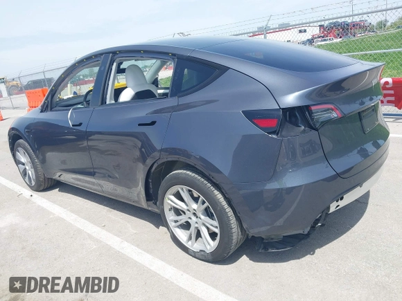 2023 Tesla Model Y Long Range z VIN 7SAYGDEE1PA158661, wystawiony jako IAAI lot #41983897 z przebiegiem 20 176 mil mil oraz . Historia ofert i sprzedaży dostępna na DreamBid. Obrazek 3.