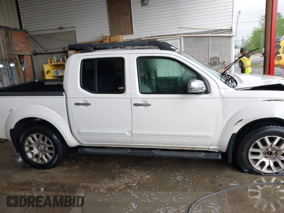2011 Nissan Frontier Pro-4X with VIN 1N6AD0EV3BC409184, listed as a IAAI auction lot 42122823 with 209,669 mi miles and . Bid and sale history available at DreamBid. Image 13.