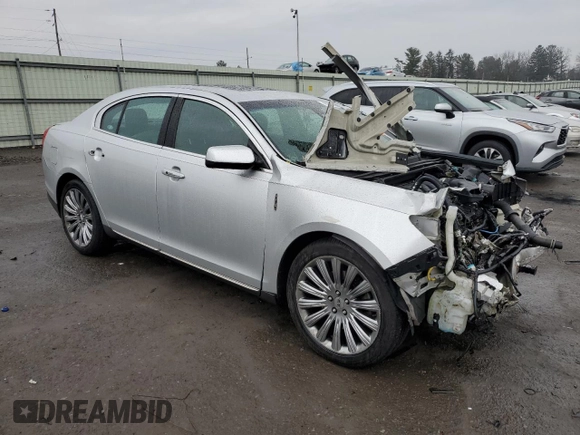 2015 Lincoln MKS with VIN 1LNHL9EK5FG607404, listed as a Copart auction lot 43246995 with Not provided miles and Salvage title. Bid and sale history available at DreamBid. Image 4.