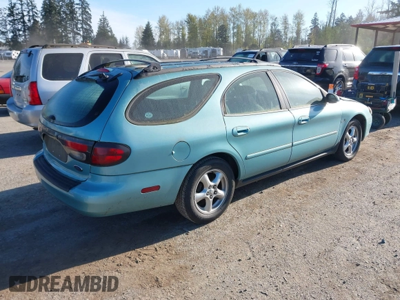 2000 Ford Taurus SE Standard z VIN 1FAFP582XYG181481, wystawiony jako IAAI lot #42033520 z przebiegiem 151 073 mil mil oraz . Historia ofert i sprzedaży dostępna na DreamBid. Obrazek 4.