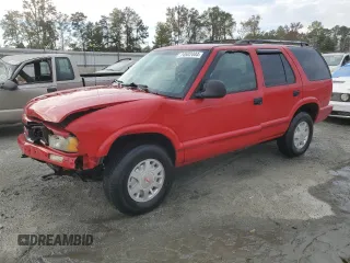 1996 GMC Jimmy SL with VIN 1GKDT13WXT2502347, listed as a Copart auction lot 74502444 with 253,735 mi miles and Salvage Title. Bid and sale history available at carsss.com. Image 1.