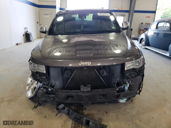 2014 Jeep Grand Cherokee Summit with VIN 1C4RJFJG5EC388545, listed as a Copart auction lot 68284754 with 189,897 mi miles and Salvage Title. Bid and sale history available at carsss.com. Image 5.