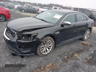 2014 Ford Taurus Limited with VIN 1FAHP2F81EG113984, listed as a IAAI auction lot 41542792 with 213,206 mi miles. Bid and sale history available at carsss.com. Image 2.