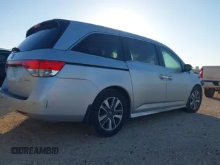 2014 Honda Odyssey Touring with VIN 5FNRL5H97EB094353, listed as a IAAI auction lot 41701712 with 141,228 mi miles and . Bid and sale history available at DreamBid. Image 4.