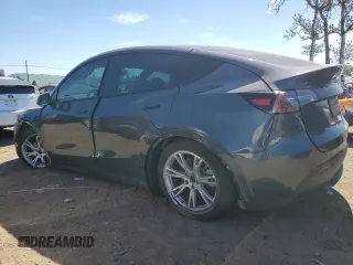 2022 Tesla Model Y Long Range with VIN 7SAYGDEE2NF402320, listed as a Copart auction lot 50396605 with 27,426 mi miles and Salvage Title. Bid and sale history available at DreamBid. Image 2.