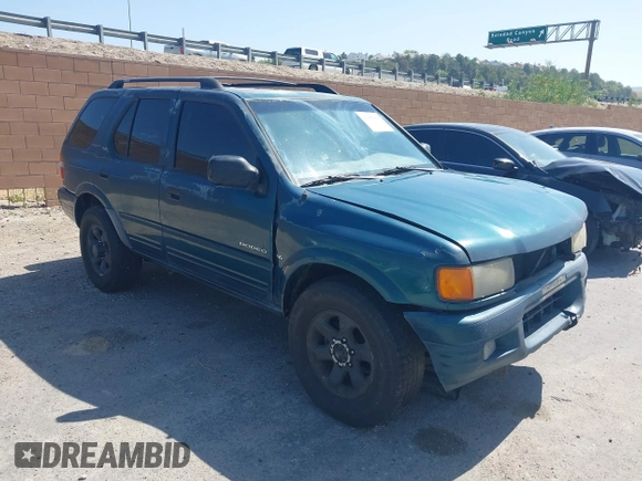1998 Isuzu Rodeo S z VIN 4S2CM58W8W4328196, wystawiony jako IAAI lot #42323556 z przebiegiem 272 915 mil mil oraz . Historia ofert i sprzedaży dostępna na DreamBid. Obrazek 1.