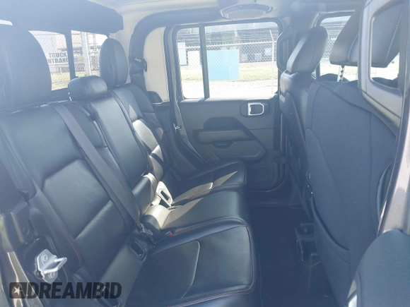 2021 Jeep Gladiator Rubicon z VIN 1C6JJTBG9ML592538, wystawiony jako IAAI lot #42206035 z przebiegiem 37 945 mil mil oraz . Historia ofert i sprzedaży dostępna na DreamBid. Obrazek 8.