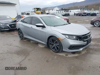 2019 Honda Civic Sport with VIN 19XFC2F81KE034047, listed as a IAAI auction lot 41995614 with 91,303 mi miles and . Bid and sale history available at DreamBid. Image 1.