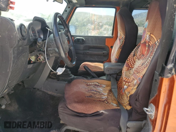 2010 Jeep Wrangler Rubicon with VIN 1J4BA6D12AL186887, listed as a Copart auction lot 57902545 with Not provided miles and Salvage title. Bid and sale history available at DreamBid. Image 7.
