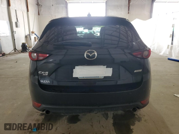 2018 Mazda CX-5 Grand Touring with VIN JM3KFBDM4J0412835, listed as a Copart auction lot 55441315 with 191,968 mi miles and Salvage title. Bid and sale history available at DreamBid. Image 6.