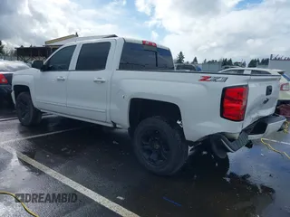 2018 Chevrolet Silverado 1500 LT with VIN 3GCUKREC5JG595959, listed as a IAAI auction lot 41608507 with 117,824 mi miles. Bid and sale history available at carsss.com. Image 3.