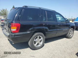 2002 Jeep Grand Cherokee Limited with VIN 1J8GW58NX2C158544, listed as a Copart auction lot 54937665 with 259,089 mi miles and Salvage title. Bid and sale history available at DreamBid. Image 3.
