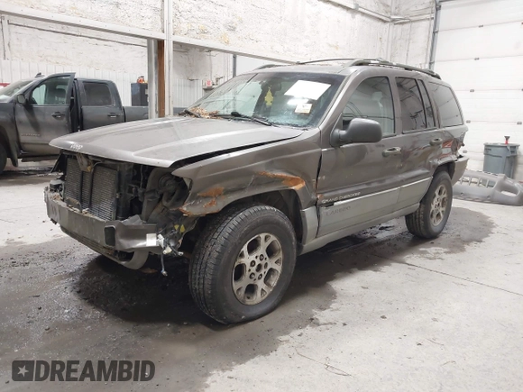 1999 Jeep Grand Cherokee Laredo with VIN 1J4GW58SXXC584734, listed as a IAAI auction lot 41902224 with 209,180 mi miles and . Bid and sale history available at DreamBid. Image 2.