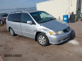 2004 Honda Odyssey EX-L z VIN 5FNRL18774B077235, wystawiony jako IAAI lot #42370951 z przebiegiem 145 333 mil mil oraz . Historia ofert i sprzedaży dostępna na DreamBid. Obrazek 1.