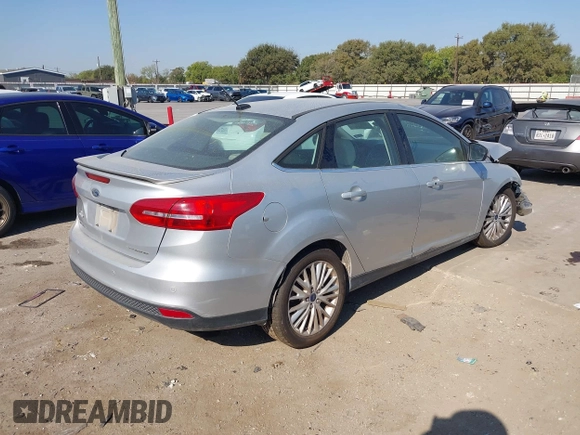 2017 Ford Focus Titanium with VIN 1FADP3J25HL268315, listed as a IAAI auction lot 41606289 with Not provided miles and . Bid and sale history available at DreamBid. Image 4.