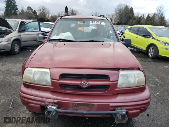 2000 Suzuki Vitara JX z VIN 2S3TD52V9Y6100173, wystawiony jako Copart lot #86200824 z przebiegiem Nie podano mil oraz Szkody całkowita. Historia ofert i sprzedaży dostępna na DreamBid. Obrazek 5.