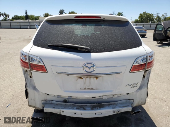 2012 Mazda CX-9 Grand Touring z VIN JM3TB3DVXC0356062, wystawiony jako Copart lot #61493905 z przebiegiem 64 731 mil mil oraz Szkoda całkowita • Salvage title. Historia ofert i sprzedaży dostępna na DreamBid. Obrazek 6.