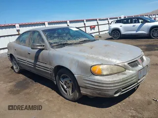 1999 Pontiac Grand Am SE z VIN 1G2NE52T5XC569855, wystawiony jako IAAI lot #42202757 z przebiegiem 186 004 mil mil oraz . Historia ofert i sprzedaży dostępna na DreamBid. Obrazek 1.