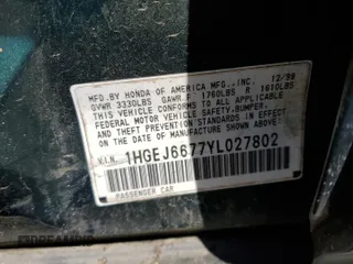 2000 Honda Civic LX with VIN 1HGEJ6677YL027802, listed as a Copart auction lot 52995445 with 221,233 mi miles and Salvage Title. Bid and sale history available at carsss.com. Image 12.