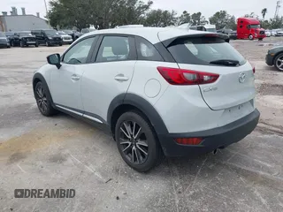 2016 Mazda CX-3 Grand Touring with VIN JM1DKDD72G0128891, listed as a IAAI auction lot 41401456 with 60,911 mi miles. Bid and sale history available at carsss.com. Image 3.