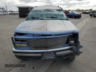 1995 GMC Yukon with VIN 1GKEK18K6SJ710419, listed as a Copart auction lot 80778474 with 215,789 mi miles and Salvage Title. Bid and sale history available at carsss.com. Image 5.