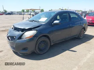 2009 Toyota Yaris with VIN JTDBT903891349784, listed as a IAAI auction lot 42135557 with 244,107 mi miles. Bid and sale history available at carsss.com. Image 2.