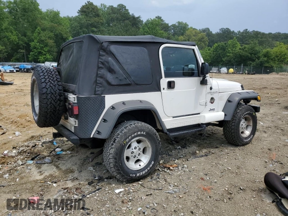 2000 Jeep Wrangler Sahara with VIN 1J4FA59SXYP760278, listed as a Copart auction lot 60402485 with 192,161 mi miles and Salvage title. Bid and sale history available at DreamBid. Image 3.