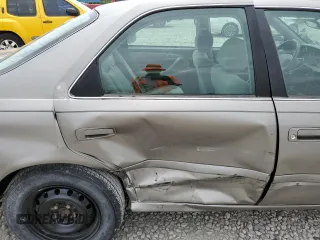 2001 Toyota Camry CE z VIN 4T1BG22KX1U085868, wystawiony jako Copart lot #58100375 z przebiegiem 122 886 mil mil oraz Szkoda całkowita • Salvage title. Historia ofert i sprzedaży dostępna na DreamBid. Obrazek 10.