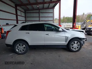 2015 Cadillac SRX Luxury Collection with VIN 3GYFNEE30FS567431, listed as a IAAI auction lot 42118084 with 140,778 mi miles. Bid and sale history available at carsss.com. Image 13.