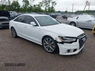 2013 Audi A6 Prestige z VIN WAUHGAFC2DN153202, wystawiony jako IAAI lot #42242052 z przebiegiem 163 295 mil mil oraz . Historia ofert i sprzedaży dostępna na DreamBid. Obrazek 1.