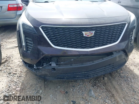 2020 Cadillac XT4 FWD Sport z VIN 1GYFZER40LF144503, wystawiony jako IAAI lot #41265649 z przebiegiem 79 120 mil mil oraz . Historia ofert i sprzedaży dostępna na DreamBid. Obrazek 6.