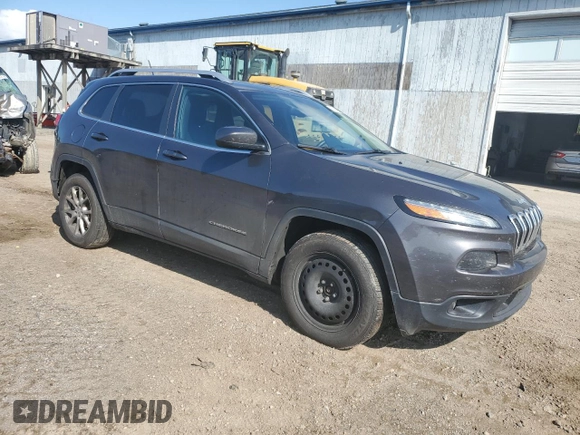 2015 Jeep Cherokee North with VIN 1C4PJMCSXFW582677, listed as a Copart auction lot 67999984 with 220,045 mi miles and Salvage Title. Bid and sale history available at carsss.com. Image 4.
