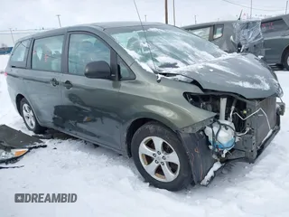 2014 Toyota Sienna L with VIN 5TDZK3DC2ES429684, listed as a IAAI auction lot 41529309 with 112,190 mi miles. Bid and sale history available at carsss.com. Image 1.