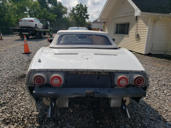 1974 Chevrolet Corvette with VIN 1Z67J4S405054, listed as a Copart auction lot 66356575 with 7,810 mi miles and Salvage title. Bid and sale history available at DreamBid. Image 6.