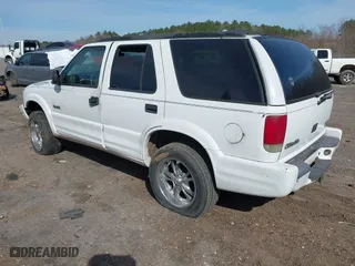1998 Oldsmobile Bravada with VIN 1GHDT13W2W2706912, listed as a IAAI auction lot 41629870 with 210,907 mi miles. Bid and sale history available at carsss.com. Image 3.