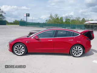 2018 Tesla Model 3 Long Range Battery with VIN 5YJ3E1EA8JF031683, listed as a IAAI auction lot 39275313 with 136,939 mi miles and . Bid and sale history available at DreamBid. Image 14.
