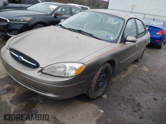 2005 Ford Taurus SE with VIN 1FAFP53215A127489, listed as a IAAI auction lot 40940239 with 127,180 mi miles. Bid and sale history available at carsss.com. Image 2.
