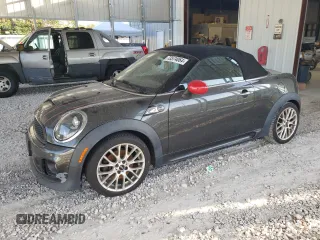 2015 MINI Roadster S z VIN WMWSY3C59FT566785, wystawiony jako Copart lot #73574064 z przebiegiem 96 623 mil mil oraz Tytuł czysty. Historia ofert i sprzedaży dostępna na DreamBid. Obrazek 1.