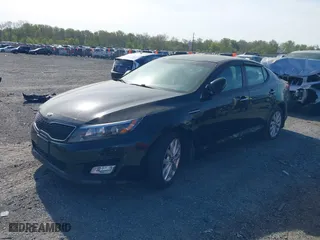 2015 Kia Optima LX with VIN KNAGM4A71F5630673, listed as a IAAI auction lot 42106584 with 245,005 mi miles. Bid and sale history available at carsss.com. Image 2.