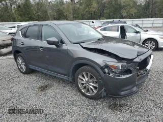 2020 Mazda CX-5 Grand Touring with VIN JM3KFADM6L0839527, listed as a Copart auction lot 46677475 with 50,305 mi miles and Salvage Title. Bid and sale history available at DreamBid. Image 4.